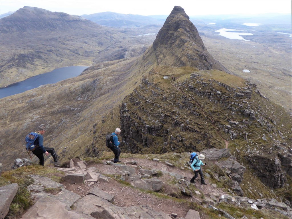 Chris, Richard and Helen start traverse off East from Suilven summit