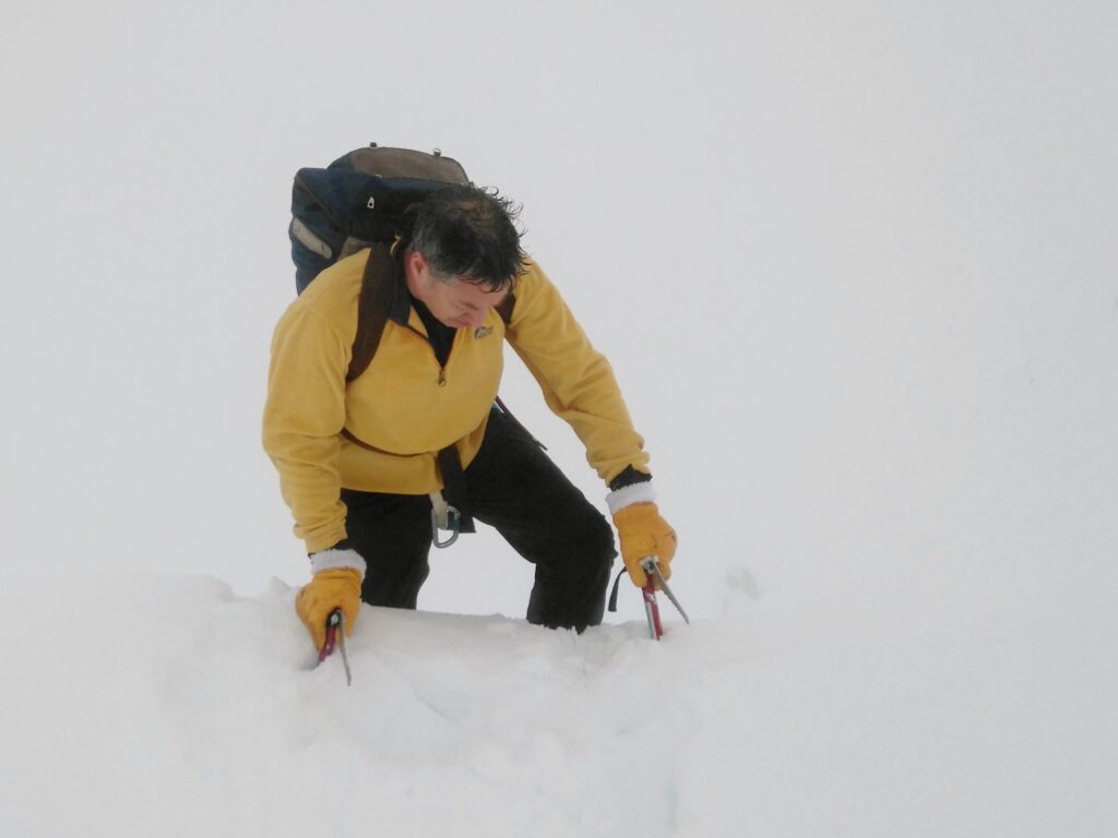 Chris Hilton emerging through the cornice on Stob Ghabhar